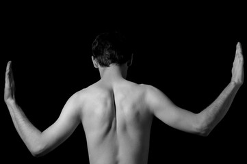 Obraz na płótnie Canvas black and white photo of a guy, hands to the sides