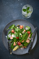 Smoked Salmon Salad. Healthy eating Tasty salad with red fish, radish and cherry tomatoes.