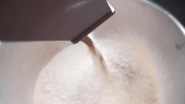 sifting flour in a factory. top view