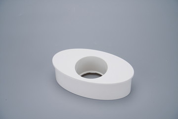 White pipe fitting on a gray background