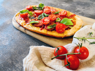 Sausage Pizza with Ham and tomatoes