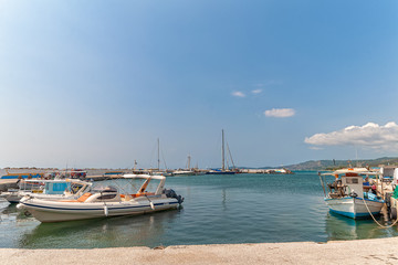 Fototapeta na wymiar Nea Skioni, Greece - September 06, 2019: The Harbour entrance at Nea Skioni Kassandra, Chalkidiki, Central Macedonia, Greece. Greek marina with parked boats and yachts