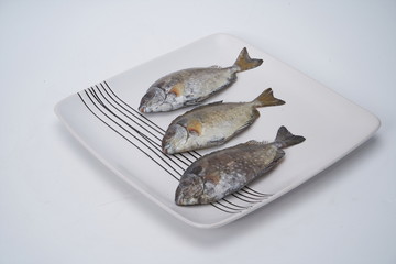 Fresh grouper on a white plate