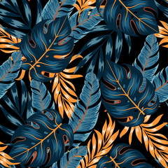 Motif tropical sans couture floral avec des plantes et des feuilles jaunes et bleues vives sur fond sombre. Feuille de jungle vectorielle continue de fond floral. Motif exotique sans couture avec des plantes tropicales
