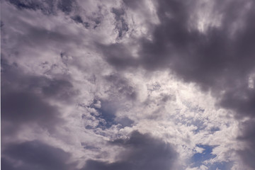 Clouds in the sky. The sun in the clouds. A look through the clouds. The clouds are floating towards the sun. The path to god. Thick steam texture. Thick fog. Sunset soon. High in the sky