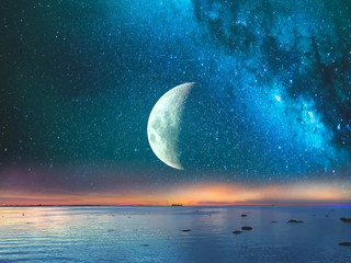 Starry night  moon on blue  sky at sea, sunset at  summer season , sea dark blue water  reflection ,moonlight blue lilac pink   background nature,tropical island , weather ,holiday travel to vacation