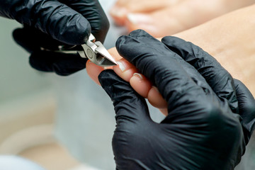 Close up cutting toenails.