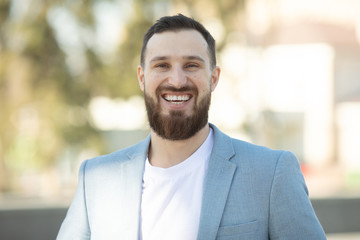 Naklejka premium Cool handsome guy with beard smiling.