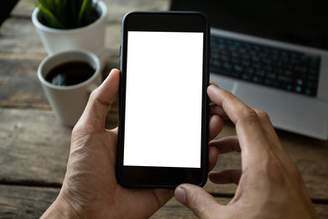 man hand using smartphone In the coffee shop,Screen blank with clipping path