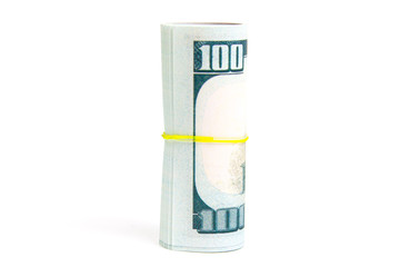 rolls with hundred dollar bills on a white background isolate, side view