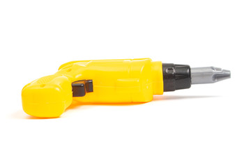 yellow toy screwdriver on a white background isolate, side view