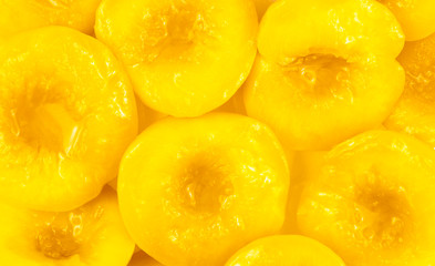 Yellow bright peach halves close-up