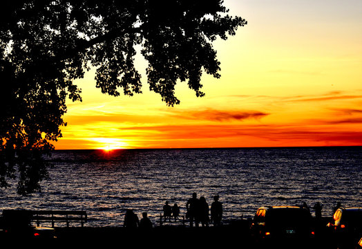 people watching sunset 