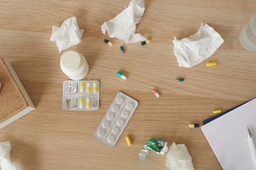 Close-up of pills and bottle with medicine on the wooden table they are for health or mental health