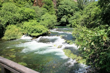 Fototapeta na wymiar flowing green water near Roski slab, N.P. Krka, Croatia
