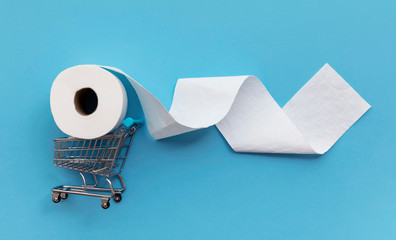 Roll of white toilet paper with a shopping cart on a blue background