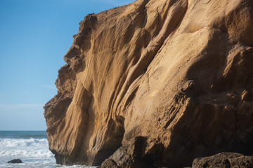 Fototapeta na wymiar Praia de Santa Cruz beach rock boulder, in Torres Vedras, Portugal