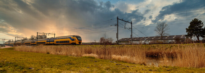 Sunset panorama with passenger train