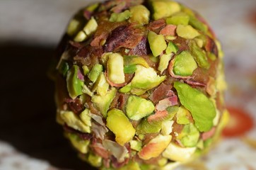 Pistachio covered date pastry mixed with fine pistachios, French butter and cardamom, close up