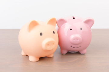 Piggy bank  on wooden background, space for text. Finance, saving money