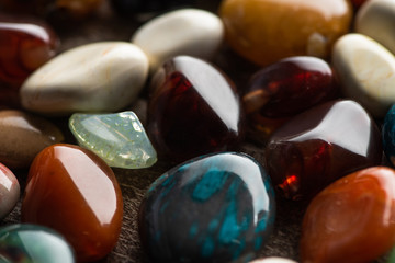 Close up view of ritual fortune telling stones on wooden background