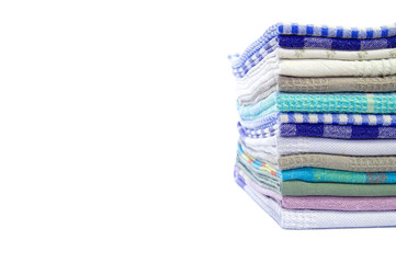Pile of linen kitchen towels over white copy space for text. colorful dish towels on white background