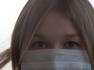 Beautiful Girl Wearing Medical Mask During Coronavirus COVID-19 Epidemic