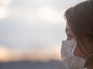 Side Space Photo Of Beautiful Girl Wearing Medical Mask During Coronavirus COVID-19 Epidemic