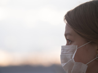 Beautiful Girl Wearing Medical Mask During Coronavirus COVID-19 Epidemic