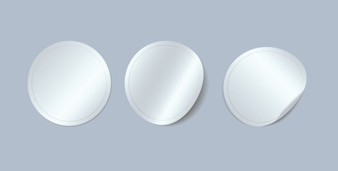 Circle adhesive symbols. White tags, paper round stickers with peeling corner, isolated rounded plastic mockup signs