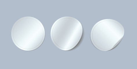 Circle adhesive symbols. White tags, paper round stickers with peeling corner, isolated rounded plastic mockup signs