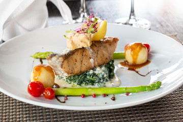 A grilled salmond on spinash