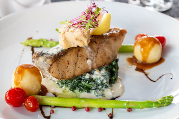 A grilled salmond on spinash