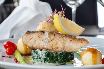 A grilled salmond on spinash