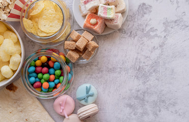 unhealthy food burgers, french fries and sweets top view flat lay with copy space