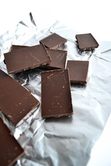 Chocolate bar in foil isolated on white background