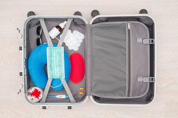 Open travel bag with virus medical protection products