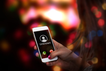 woman gets bothering call with unknown number on her smartphone