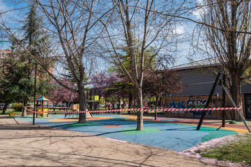 PALENCIA, SPAIN - MARCH 13, 2020: closed and empty children playgrounds in Spain because of coronavirus pandemic, covid-19, crisis