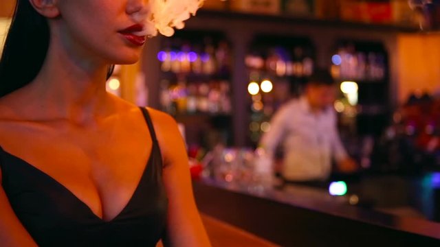 Nightlife. Beautiful Sexy Woman smoking. Vape Party