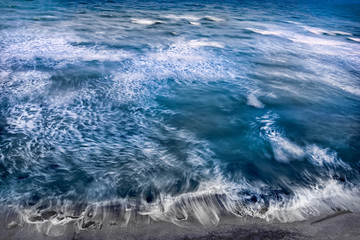 Naklejka na ściany i meble Beautiful view of the sea with long exposure white waves washing the shore, Vama Veche, Black Sea, Romania