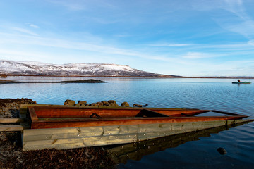 Fototapeta na wymiar Boat near lake in Iceland in winter