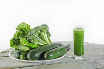 smoothies made from green vegetables and vegetables on a white background