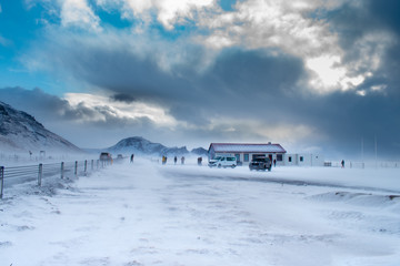 Iceland road in sunny winter day before storm