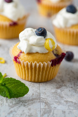 Passion Fruit Cupcakes with Whip Cream and Berries