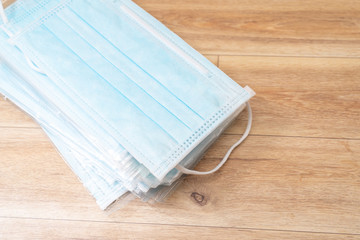 Surgical mask with rubber ear straps. Typical 3-ply surgical mask to cover the mouth and nose. Procedure mask from bacteria. Protection concept.