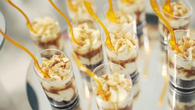 Close up. Decorated delicious catering banquet table with different sweet food cake on corporate christmas birthday party event or wedding celebration top view. Wedding candybar