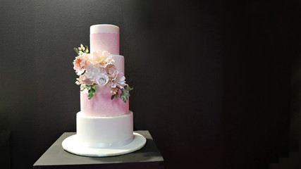 White wedding cake with flowers, roses