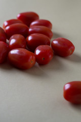 red bright tomatoes on a monotone background