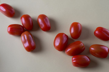 red bright tomatoes on a monotone background